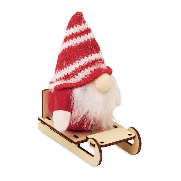 Tomte på träsläde